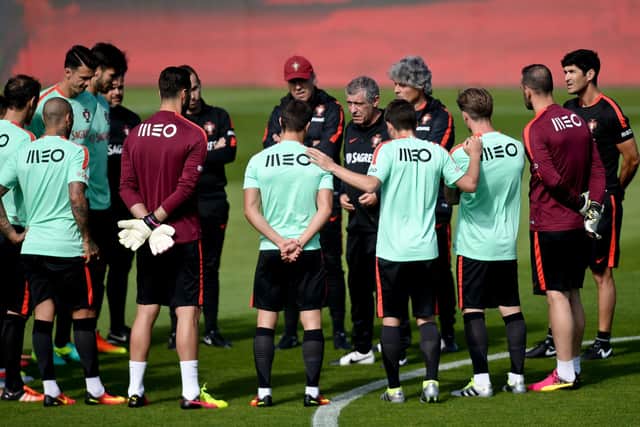 Portugal's head coach Fernando Santos (C) gives instructions to his players during the first training session of Portugal's team in preparation for the Euro 2016 at Portugal's team training center "Cidade do Futebol: PATRICIA DE MELO MOREIRA/AFP via Getty Images