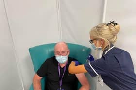 Covid vaccinations. Michael Burnell who works supporting the Sheffield Hospitals Pharmacy team aged 81 and 3/4!!! having his vaccination from Sister Amber Mills.