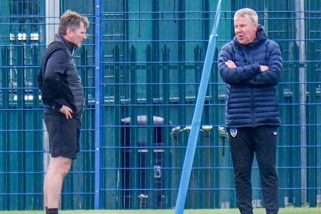 Pompey boss Kenny Jackett, right, and assistant Joe Gallen in discussions at a social distance.