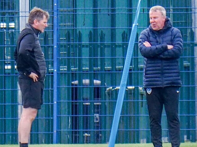 Pompey boss Kenny Jackett, right, and assistant Joe Gallen in discussions at a social distance.