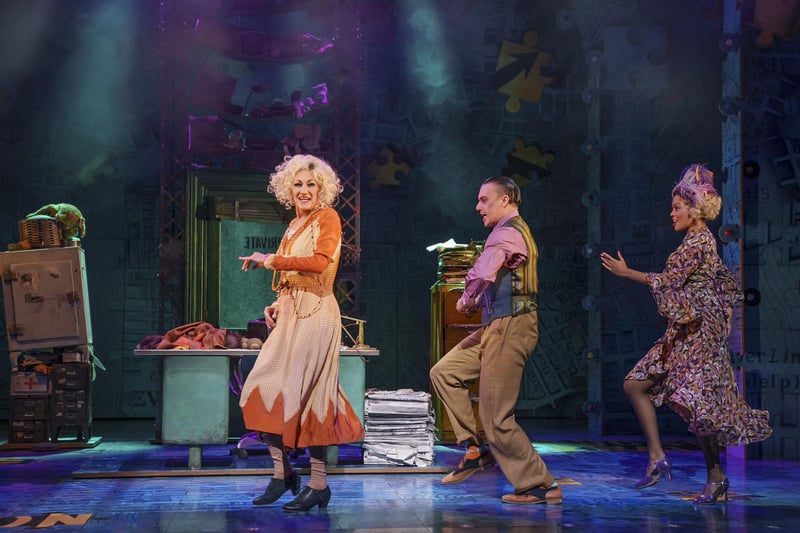 Paul O’Grady in Annie, his last role before his death. This picture shows him on stage at the Playhouse.