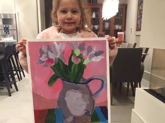 A Young Masters entrant with her picture.