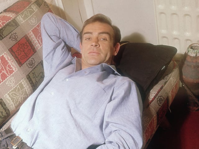Sean Connery, best known for his role in seven of the James Bond films, relaxing in his ground floor basement flat in London's NW5. 