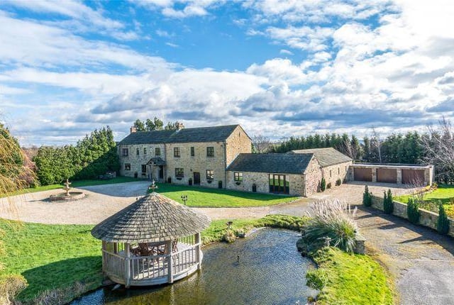 This four bedroom house has four reception rooms, swimming pool and gymnasium.