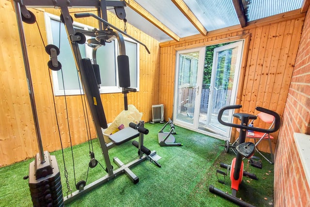 This garden room is a versatile space which is currently used as a gym.