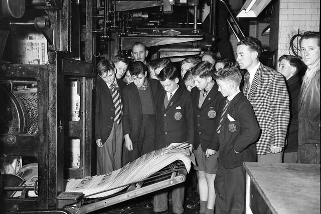 Golspie Technical School pupils visiting The Scotsman office in October 1960 watch television guides being printed.