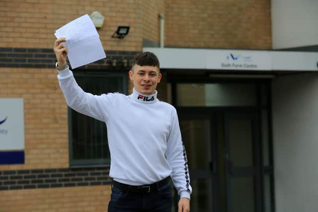 A student gets their results on A-Level results day. Photo by Chris Etchells