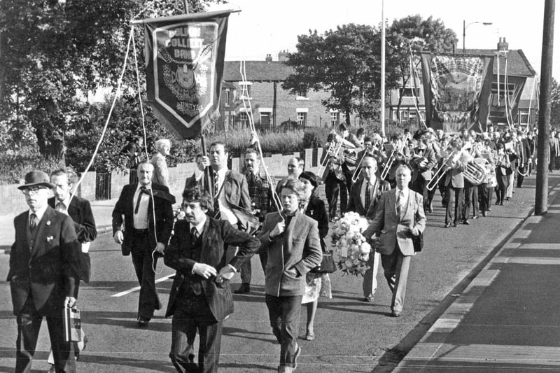 Boldon Colliery miners with their band and banners marching through the village in 1980.