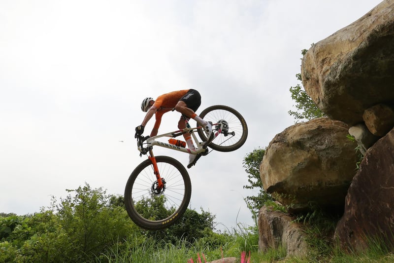 Mathieu van der Poel of Team Netherlands suffers a fall during the Men's Cross-country race on day three of the Tokyo 2020 Olympic Games at Izu Mountain Bike Course