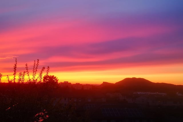 Vivid pinks, purples and oranges captured in this photograph of Arthur's Seat.