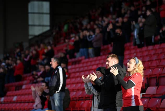 BARNSLEY, ENGLAND - MAY 17: Barnsley fans applaud the team as they take to the field during the Sky Bet Championship Play-off Semi Final 1st Leg match between Barnsley and Swansea City at Oakwell Stadium on May 17, 2021 in Barnsley, England. (Photo by Laurence Griffiths/Getty Images)