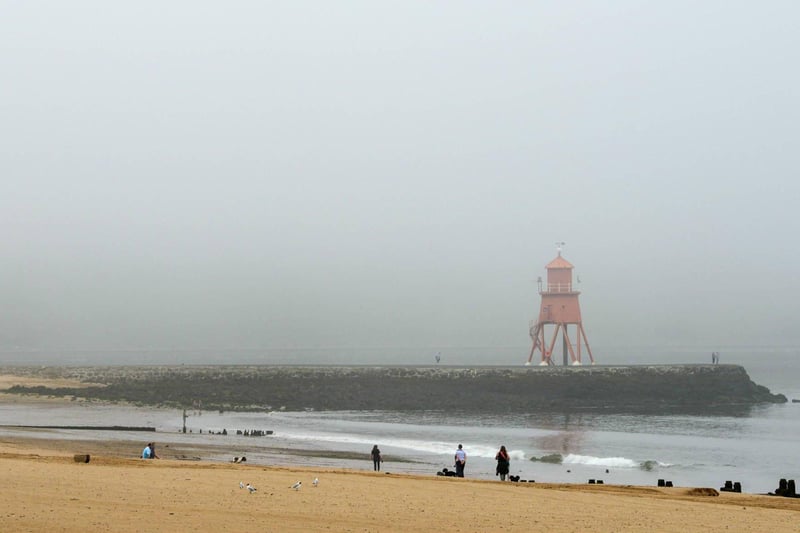 The Groyne lighthouse is barely visible through the fog.