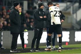 Derby County's William Osula looks frustrated as he walks past manager Paul Warne after being shown a red card by referee Martin Woods for violent conduct during the Sky Bet League One match at Pride Park Stadium, Derby. Nigel French/PA Wire.