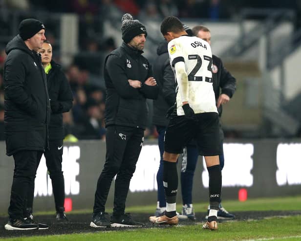 Derby County's William Osula looks frustrated as he walks past manager Paul Warne after being shown a red card by referee Martin Woods for violent conduct during the Sky Bet League One match at Pride Park Stadium, Derby. Nigel French/PA Wire.