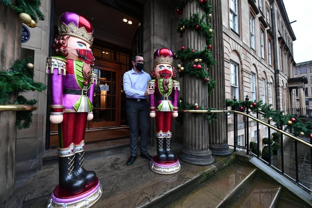 In what’s possibly the most 2020 festive display, Glasgow’s Blthyswood Hotel welcomed two masked toy solider statues as a new addition to their Christmas decorations. Here they are with Bryan Tali, guest services manager at the hotel.