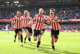 Tommy Doyle (front left) of Sheffield United celebrates with James McAtee and his Sheffield United team mates: Jan Kruger/Getty Images