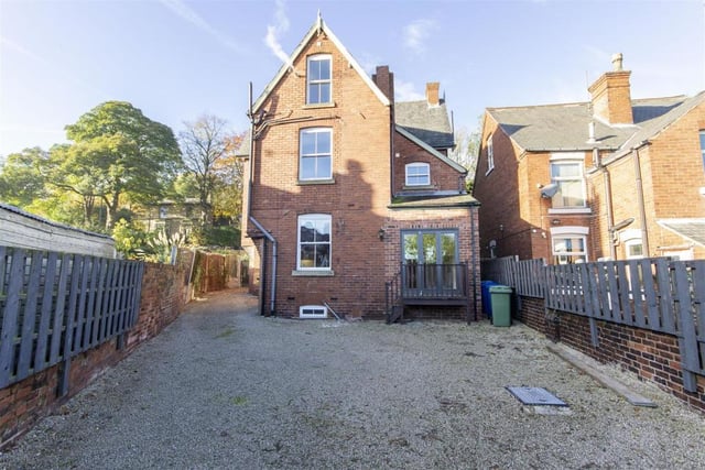 At the rear of the property is a gravelled parking space with access leading down the side of the house from the main Sheffield Road.