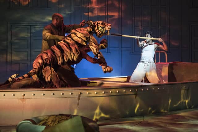 Actor Owain Gwynn performing with Richard Parker the Tiger and Hiran Abeysekera as Pi in Life of Pi. The production was a big hit at the Crucible Theatre in Sheffield and is now transferring to London's West End