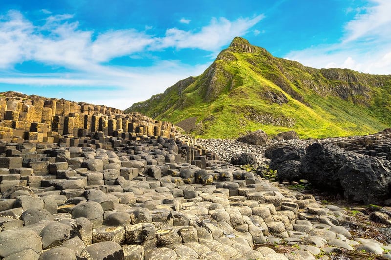 Take a walk along the Giant’s Causeway in Northern Ireland, where you’ll find a landscape of dramatic cliffs, hidden coves and islands to explore along the rugged coastline.