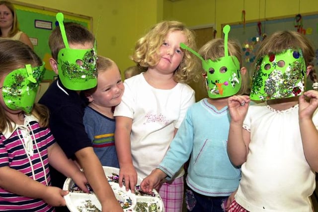 Children attending St Marys Summer club making alien masks in 2003.