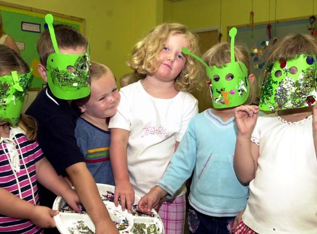 Children attending St Marys Summer club making alien masks in 2003.