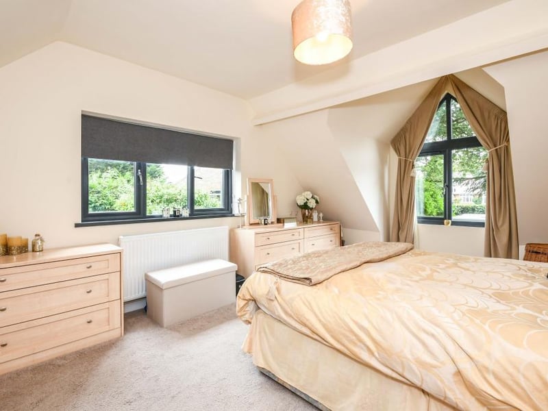 Bedroom four is a first-floor, double bedroom with two double-glazed windows, built-in wardrobes and a double radiator.