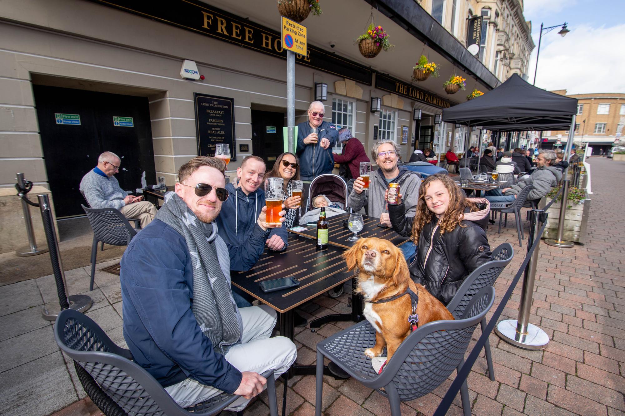 Jerome Matthews, Jasmine the dog, Derek Smith, Selma Matthews, Kaylan 2, Alister English and Sienna Matthews 11 outside The Lord Palmerston, Palmerston Road, Southsea on 12 April 2021. Picture: Habibur Rahman