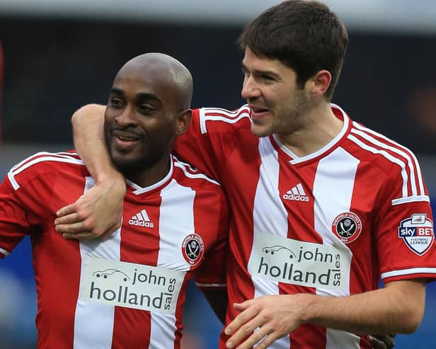 Sheffield United's Jamal Campbell-Ryce (left) and Ryan Flynn celebrate after beating QPR 3-0 at Loftus Road: Nigel French/PA Wire