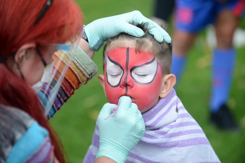 Jacob Arkus-Duhra, 4 getting his face painted.