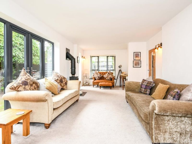 There are wall lights, a double radiator and a multi-fuel burner in the sitting room.