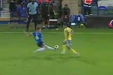 Sheffield Wednesday manager Darren Moore felt Peterborough United man Frankie Kent should have been sent off for this tackle on Lee Gregory.