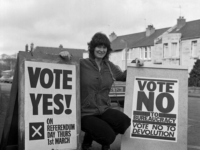 Nurse Margaret McEwan outside Roseburn polling station in Edinburgh before voting in the Scottish devolution referendum in March 1979. Ms McEwan with Yes board and No board.