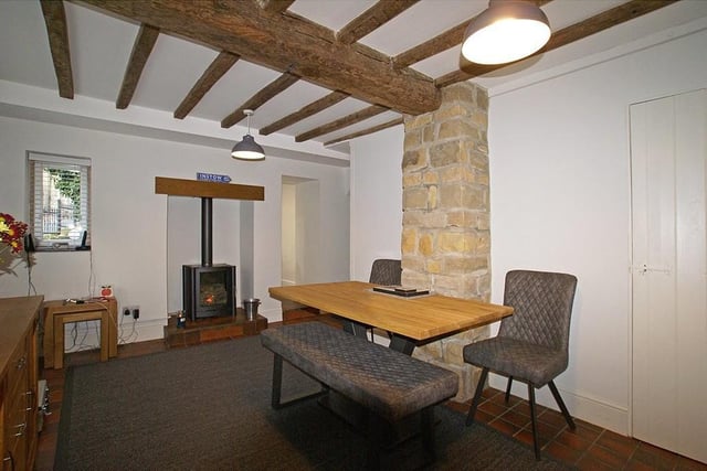 Rustic wooden beams and a feature fireplace add to the olde worlde charm of the property.