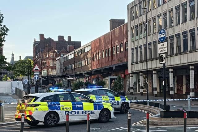 Pinstone Street in Sheffield has been cordoned off by police today (July 7) over reports of a man on a construction site roof.
