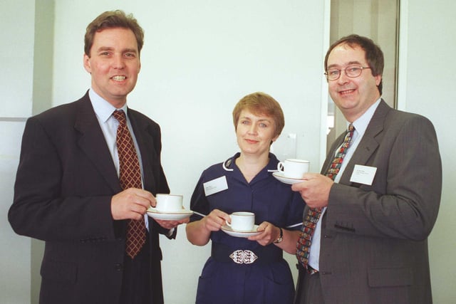 Health minister Alan Millburn (left) spares time for a cup of tea and a chat on a flying visit to the racecourse exibition centre for an NHS conference on primary healthcare. Pictured with him are  community nurse Janet Dove and Dr John Felton who's the principal GP at the mount group practice Doncaster in 1998