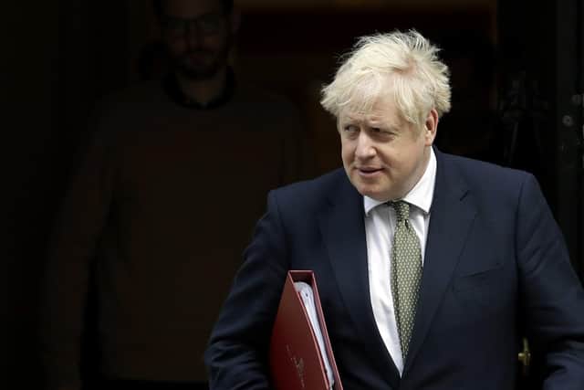 British Prime Minister Boris Johnson walks from 10 Downing Street to a meeting with his ministers at the Foreign Office, in London (AP Photo/Matt Dunham, file).