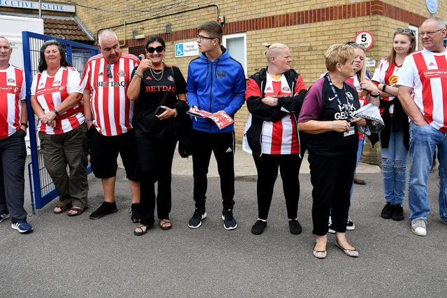 Sunderland fans line-up waiting to go through the turnstile at an away game.