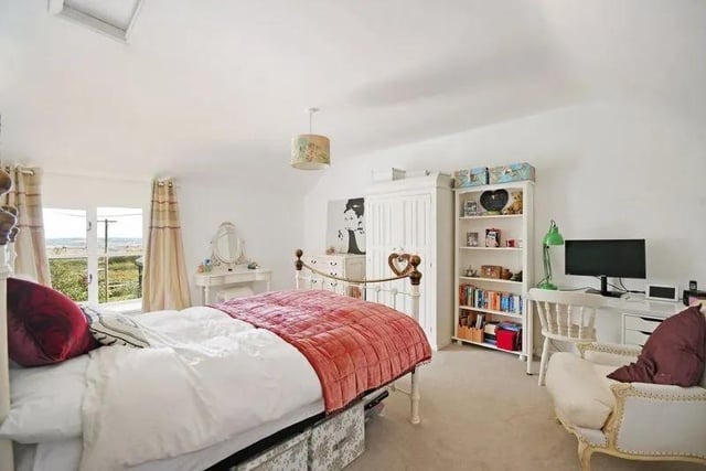 This bedroom is found at the front of the property and is, like all the others, very bright and spacious. This one in particular shows the potential for creativity for how you get furniture into the room.