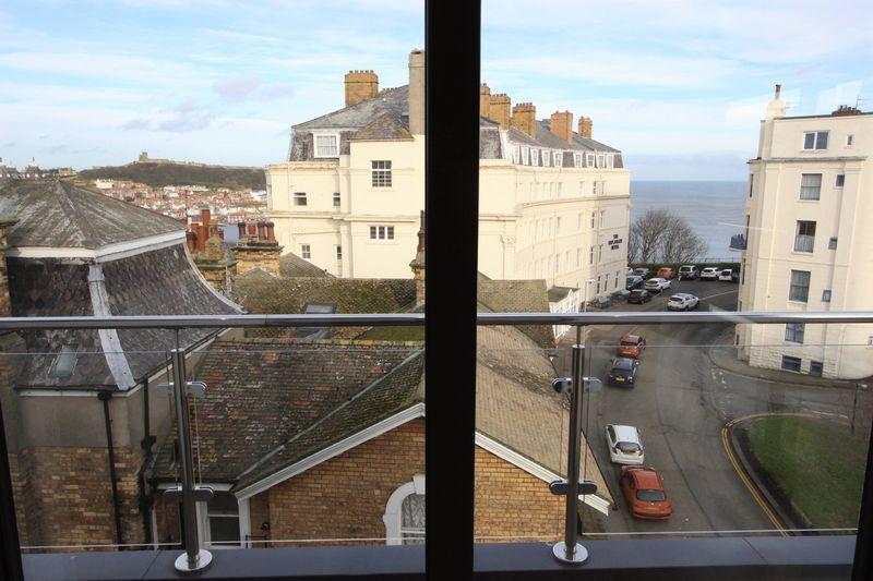 Looking west along Belmont Road towards South Bay, with Scarborough Castle to the left.