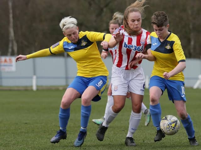 Kirsty Smith and Abby Watkinson battle for possession. Photo: Julian Barker