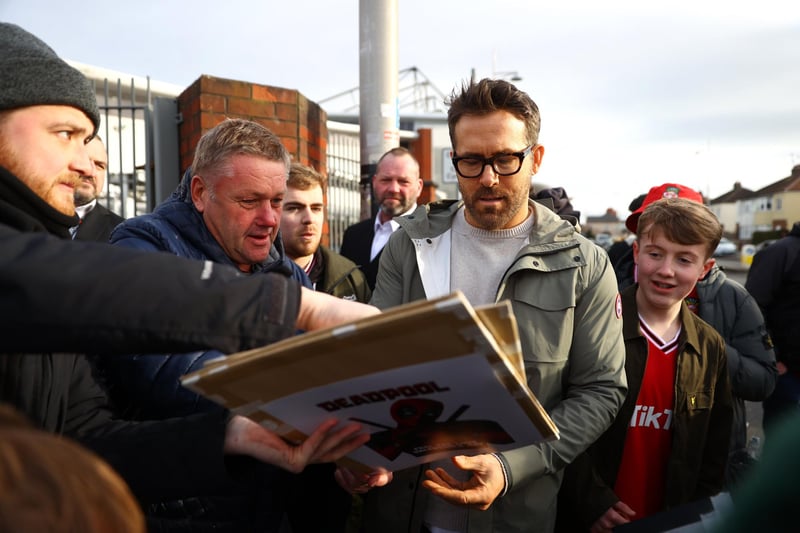 Ryan Reynolds signs autographs and speaks to fans at the old Racecourse ground. Reynolds' and McElhenney's efforts to run the club were documented in the Disney+ show 'Welcome to Wrexham'. (Photo by Michael Steele/Getty Images)