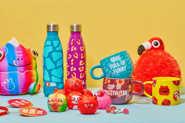 Sainbury's have partnered with Comic Relief to bring you Red Nose Day merchandise. Seen here is a selection of some of the red noses, mugs, lanyards, waterbottles, toys and pins available to buy, with money going towards Red Nose Day 2022. (Photo by Jamie Lau/Comic Relief)