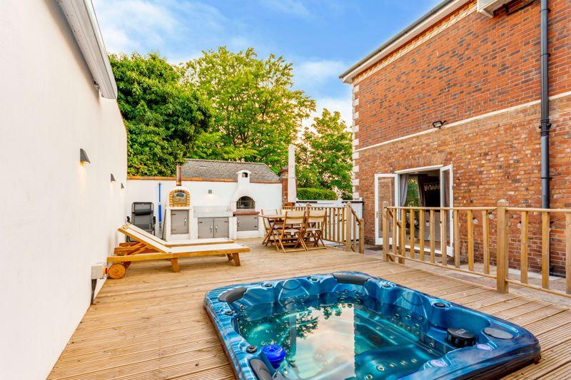 Enjoy pizza parties at this six-bedroom home as the deck where the hot tub is also has a pizza oven. Guide price: £650,000