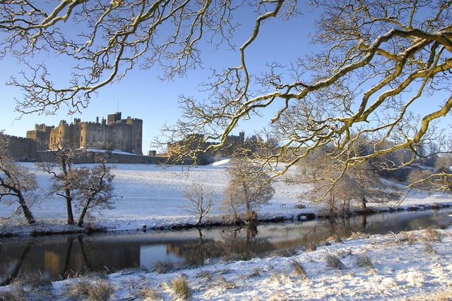 Alnwick Castle viewed from a snowy Pastures.