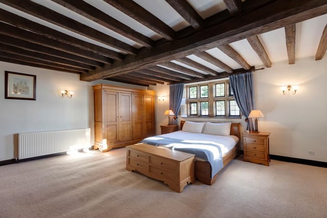 The master bedroom is exceptionally large - it boasts an open fireplace with an ornate timber mantel, cast iron surround and a stone hearth.