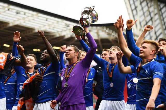 Players of Hartlepool United celebrate with the Vanaram National League Trophy during the Vanarama National League Play-Off Final match between Hartlepool United and Torquay United at Ashton Gate on June 20, 2021 in Bristol, England. (Photo by Harry Trump/Getty Images)