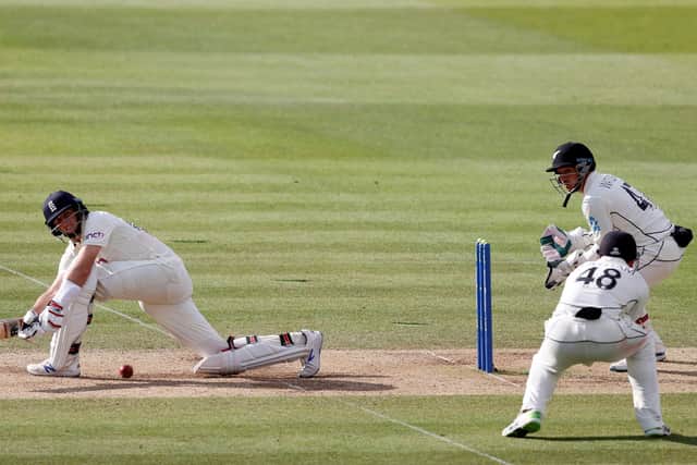 England's Joe Root (L) plays a shot on the fifth day of the first Test cricket match between England and New Zealand at Lord's.
