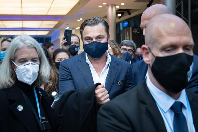 Leonardo DiCaprio was pictured walking through the exhibition hall with an entourage.
