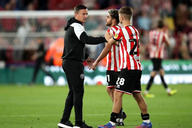 Sheffield United manager Paul Heckingbottom (left) celebrates with players Reda Khadra and James McAtee (right) after the final whistle: Isaac Parkin/PA Wire