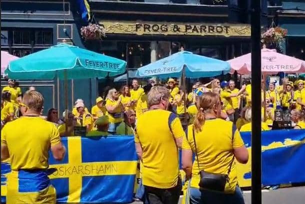 Sweden football fans brought Abba to Sheffield city centre tonight with a mass singalong in the town centre. Pictures shows fans singing outside The Frog and Parrott